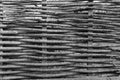 A fence made of woven tree branches. Black and white photo Royalty Free Stock Photo