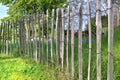 fence in natural wood posts protecting in a garden