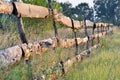 Fence of old planks in the garden in the field Royalty Free Stock Photo