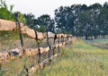 Fence of old planks on the garden in the field, autumn grass Royalty Free Stock Photo