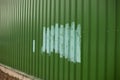 Fence painted after vandalism. Painting over graffiti on the fence Royalty Free Stock Photo