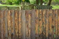 Fence, palings of unrefined wood.