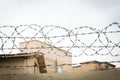 Fence with rolled barbed wires