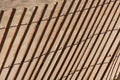 A fence in a sand dune with many diagonal lines Royalty Free Stock Photo