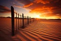 Fence in the sand with sunset in the background. Generative AI Royalty Free Stock Photo