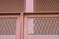 fence, metal grid, construction details of a steel frame building, school complex, campus Royalty Free Stock Photo