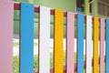 The fence of the school is in a colorful community. backgruond Royalty Free Stock Photo