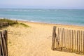 Fence sea path way access Atlantic beach in sand dunes in isle oleron ocean france Royalty Free Stock Photo