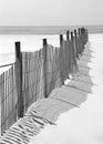 Fence and Shadow on Beach Royalty Free Stock Photo