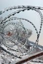 Fence with sharp barbed wire Royalty Free Stock Photo