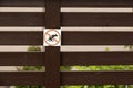 Fence with sign dogs fouling prohibited Royalty Free Stock Photo