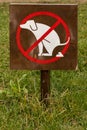 Fence with sign dogs fouling prohibited Royalty Free Stock Photo