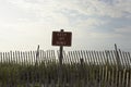 Fence and sign reading 'keep off dunes' Royalty Free Stock Photo