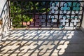 Fence silhouette shadow drawn on the ground. Pattern of parallel with crosses. Dark thin shapes on a lighted flat surface. Graphic Royalty Free Stock Photo