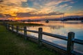 Fence and sunset over the Folly River, in Folly Beach, South Car