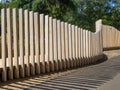 Fence from vertical wooden boards of various heights