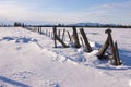 Fence in winter on a sunny day. Royalty Free Stock Photo