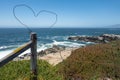 Heart in the fence wire above the ocean Royalty Free Stock Photo