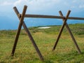 The fence wood logs in the mountains of Monte Baldo in Malcesine in Italy in a green meadow Royalty Free Stock Photo