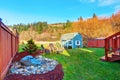 Fenced back yard with blue barn shed. Royalty Free Stock Photo