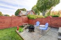 Fenced back yard with patio area and barbecue grill