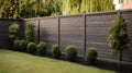 Fenced backyard. View of lawn and blooming flower beds