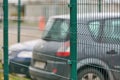 Fenced car parking lot with security Royalty Free Stock Photo