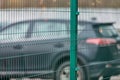 Fenced car parking lot with security Royalty Free Stock Photo