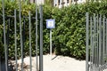 Fenced and hedged place with outdoor dog potty area or toilet and potty station with pea gravel Royalty Free Stock Photo