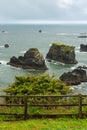 A fenced part of Arch Rock Viewpoint overlooking rock formations in the Pacific Ocean in Oregon, USA Royalty Free Stock Photo