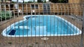 Fenced swimming pool Royalty Free Stock Photo