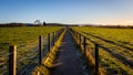A fenced trail through agricultural land in the Scottish countryside in winter Royalty Free Stock Photo