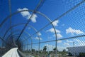 Fenced Walkway on Blue Sky