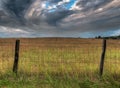 Fenceline and Dramatic Clouds Royalty Free Stock Photo