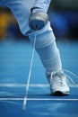 Fencers precise footwork mastering the lunge in olympic games, showcasing agility and technique Royalty Free Stock Photo