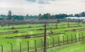 Fences and barracks at The Nazi concentration camp of birkenau in Oswiecim, Poland, a UNESCO World Heritage Royalty Free Stock Photo