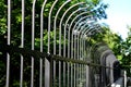 Fencing of building from forged bars with curved spikes. military guarded bases and an embassy with increased protection against o