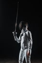 In fencing mask holding rapier Royalty Free Stock Photo