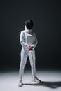 In fencing mask holding rapier under Royalty Free Stock Photo