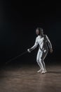 In fencing suit and mask training