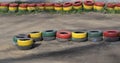 Fencing of tires painted with paint of different colors .