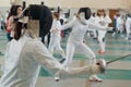 Fencing tournament. A girls holding a saber in the hall