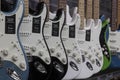 Fender Stratocaster guitar display at a music store. Strats are world renowned for their distinctive clean sound