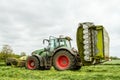 Fendt green tractor with claas mowers in silage field Royalty Free Stock Photo