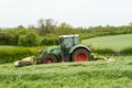 Fendt green tractor with claas mowers in silage field