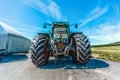 Fendt tractor with a loader wagon, working on a biogas plant