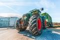 Fendt tractor with a loader wagon, working on a biogas plant