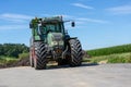 Fendt tractor with a loader wagon, working on a biogas plant