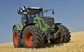 Fendt tractor working on a harvested field Royalty Free Stock Photo