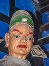 Closeup of stern male head in hell at religious Ghost City, Fengdu, China